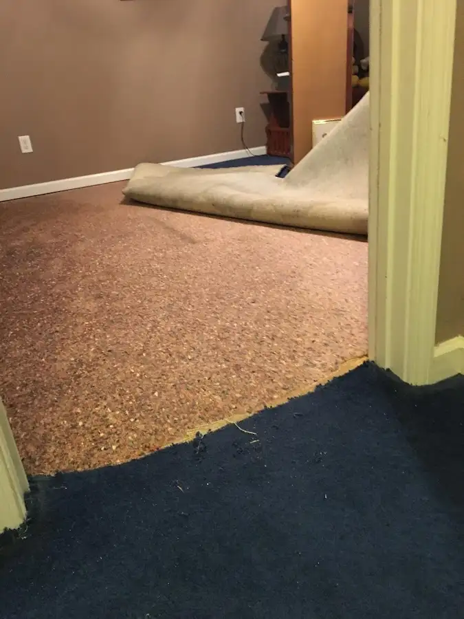Carpet pad removal revealing water damage during Water Mitigation Services in Mead Valley